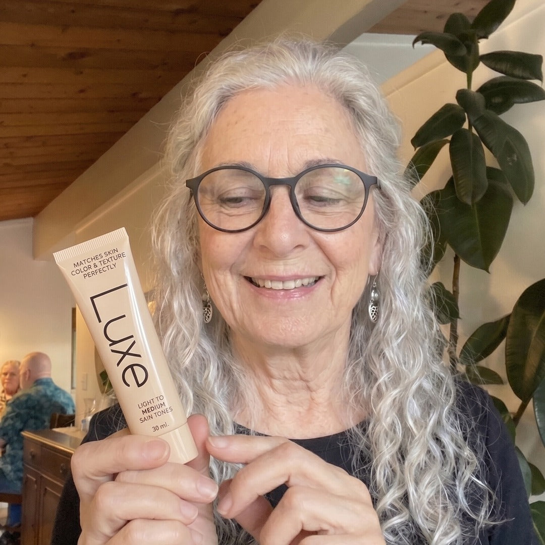 Woman holding the Color Changing Foundation
